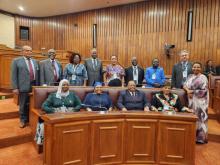 Speakers and Leaders of Delegations pose for a photo in the Mauritius National Assembly Chamber
